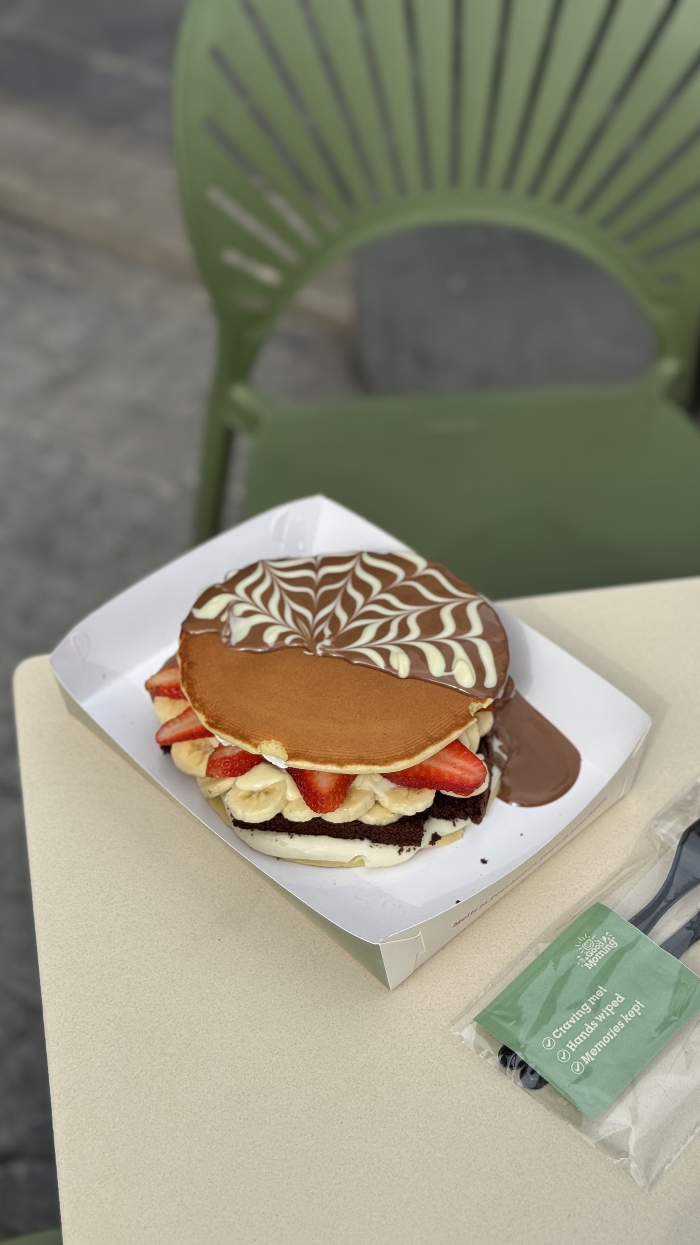 Image of Chocolate Burger – 2 pancake layers, pastry cream, brownies, strawberry & banana slices all in between. Topped with Belgium chocolate.