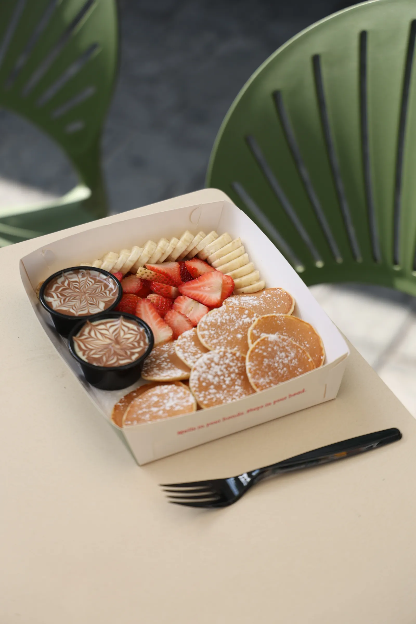 Image of Mini Pancakes – 15 mini pancakes, strawberry, banana. Belgium Chocolate dip, and your choice of lotus, white, or pistachio dip 
