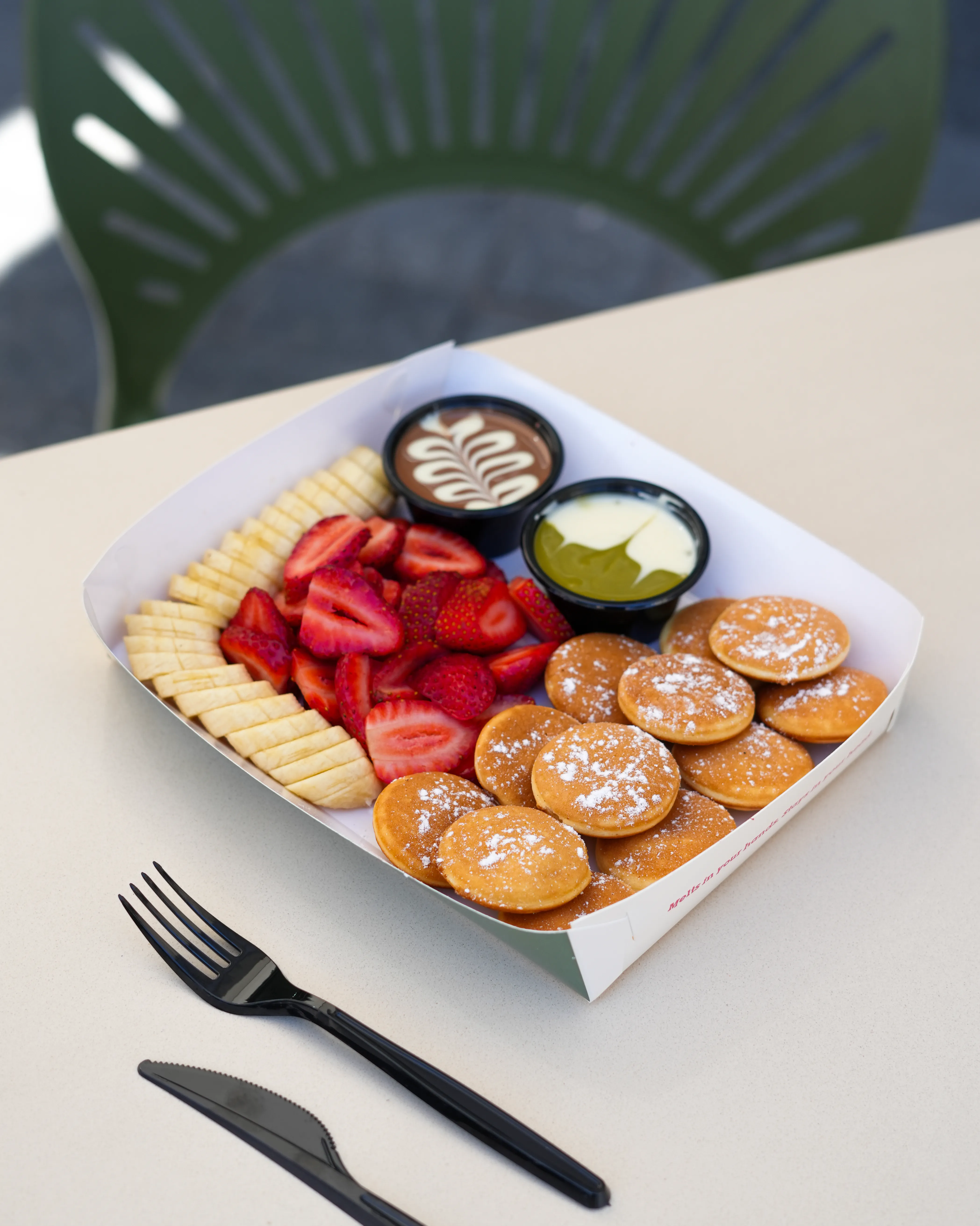 Image of Mini Pancakes – 12 mini pancakes, strawberry, banana. Belgian chocolate and your other choice dip